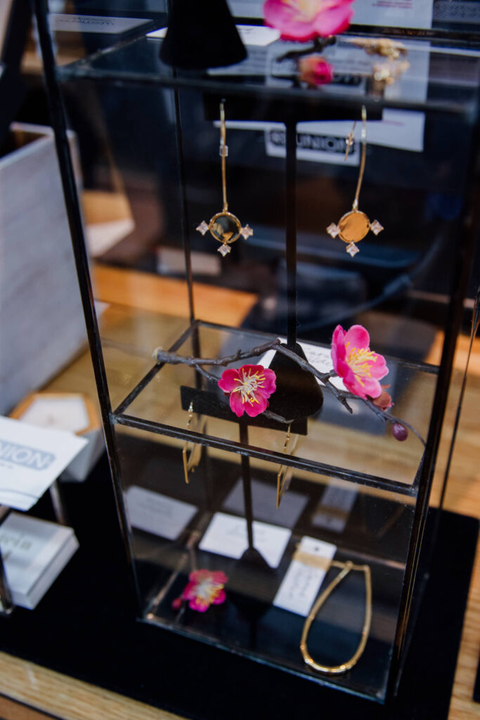 Gold earrings on display in a boutique in Victoria, BC.