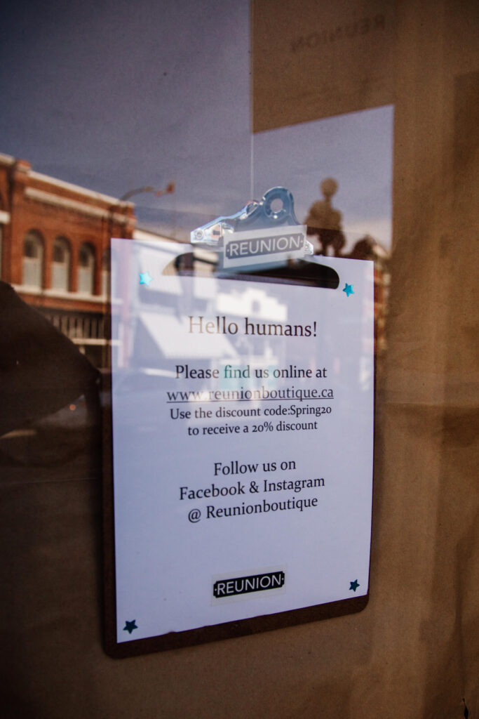 A sign showing how to connect to a store via social media during COVID-19 pandemic.