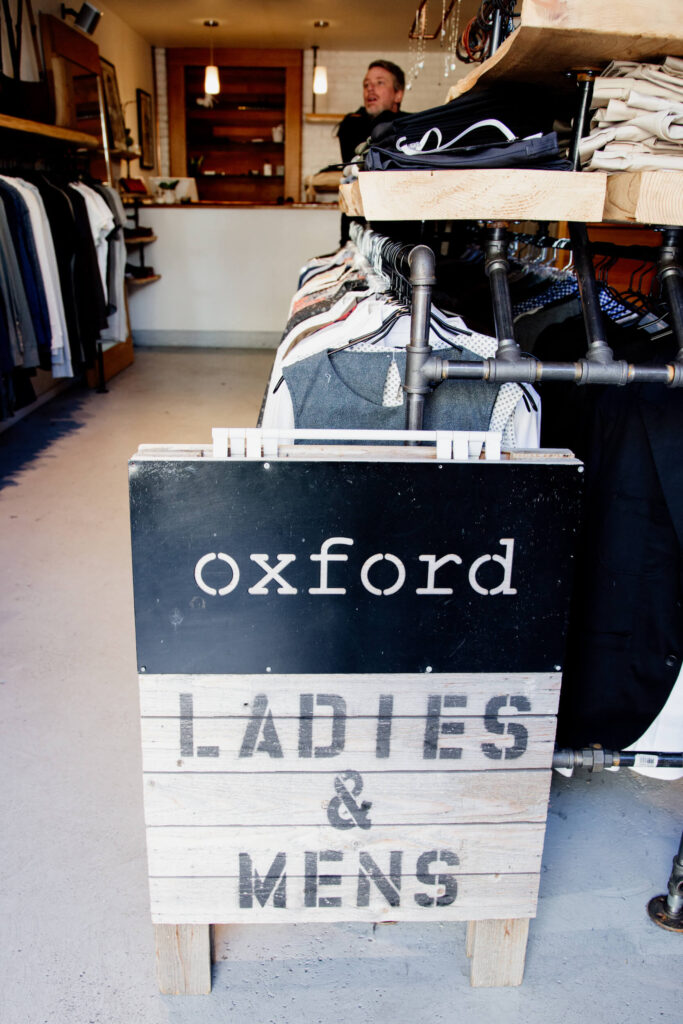 Clothes and bags in a clothing shop in Victoria, Canada.