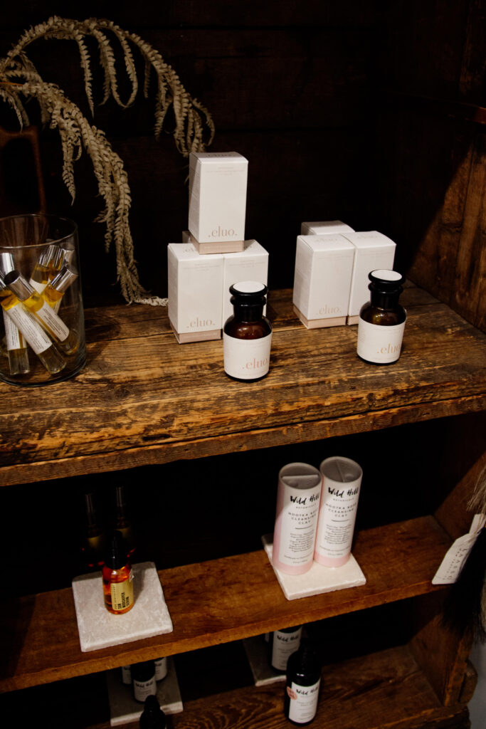 Beauty products on a shelf in a shop.