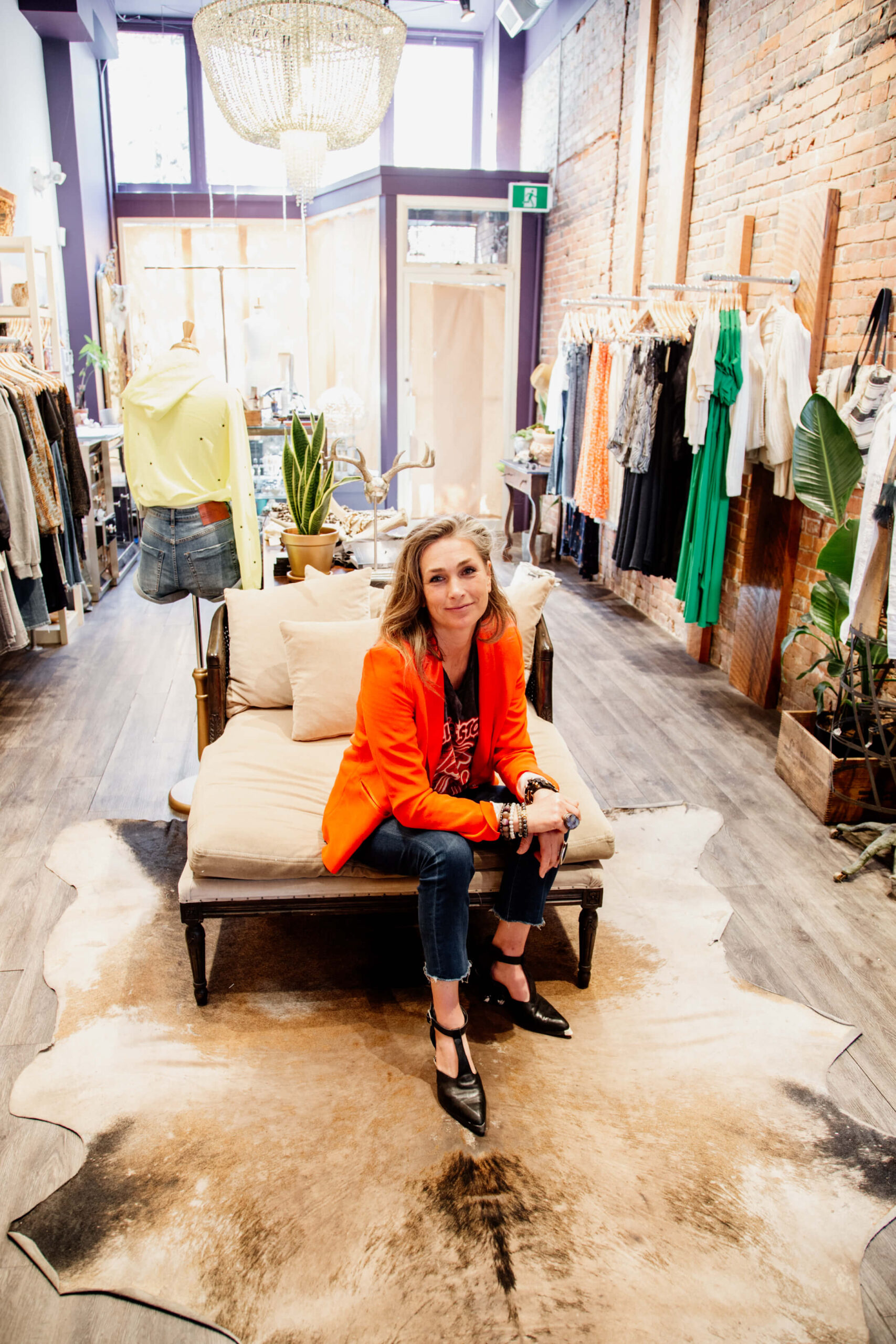 Shopowner sits in her shop.