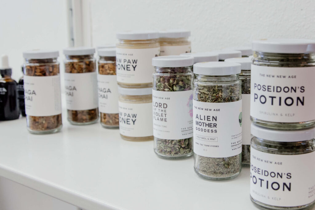 Jars of food products on a shelf at a shop.