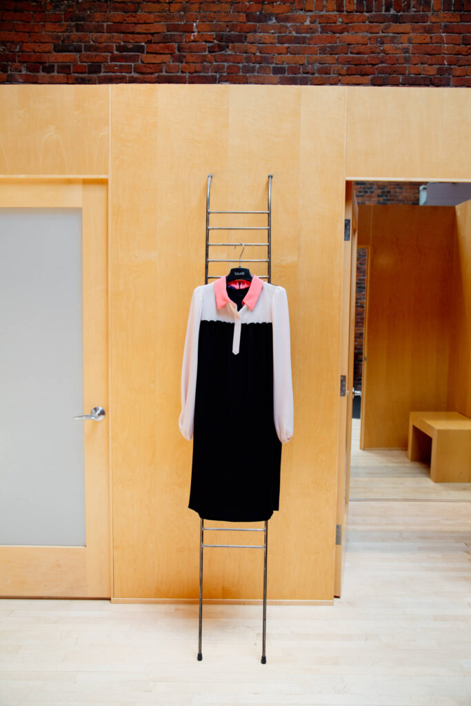 Dress on a hanger in a store.