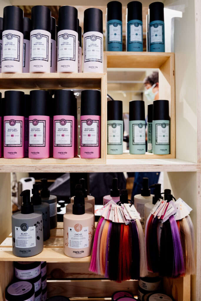 Hair products on a shelf.