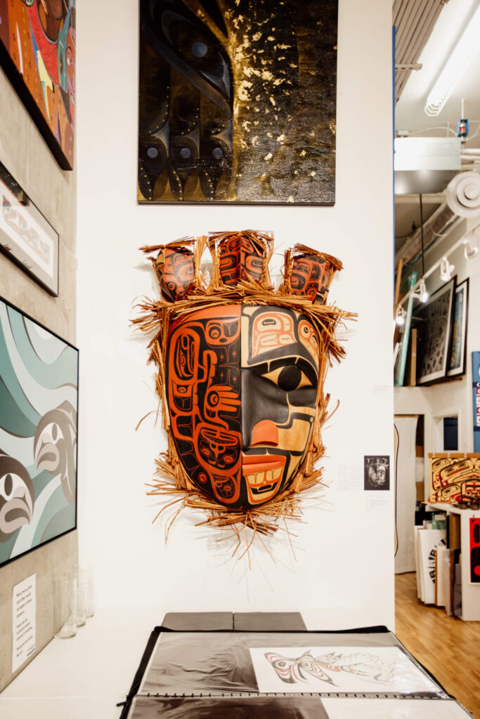 Mask on the walls in an Indigenous art gallery in Victoria, BC.