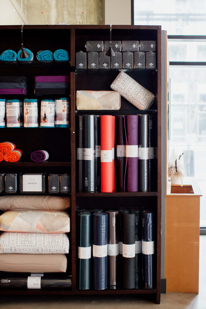 Yogas mats in a cupboard at a yoga studio